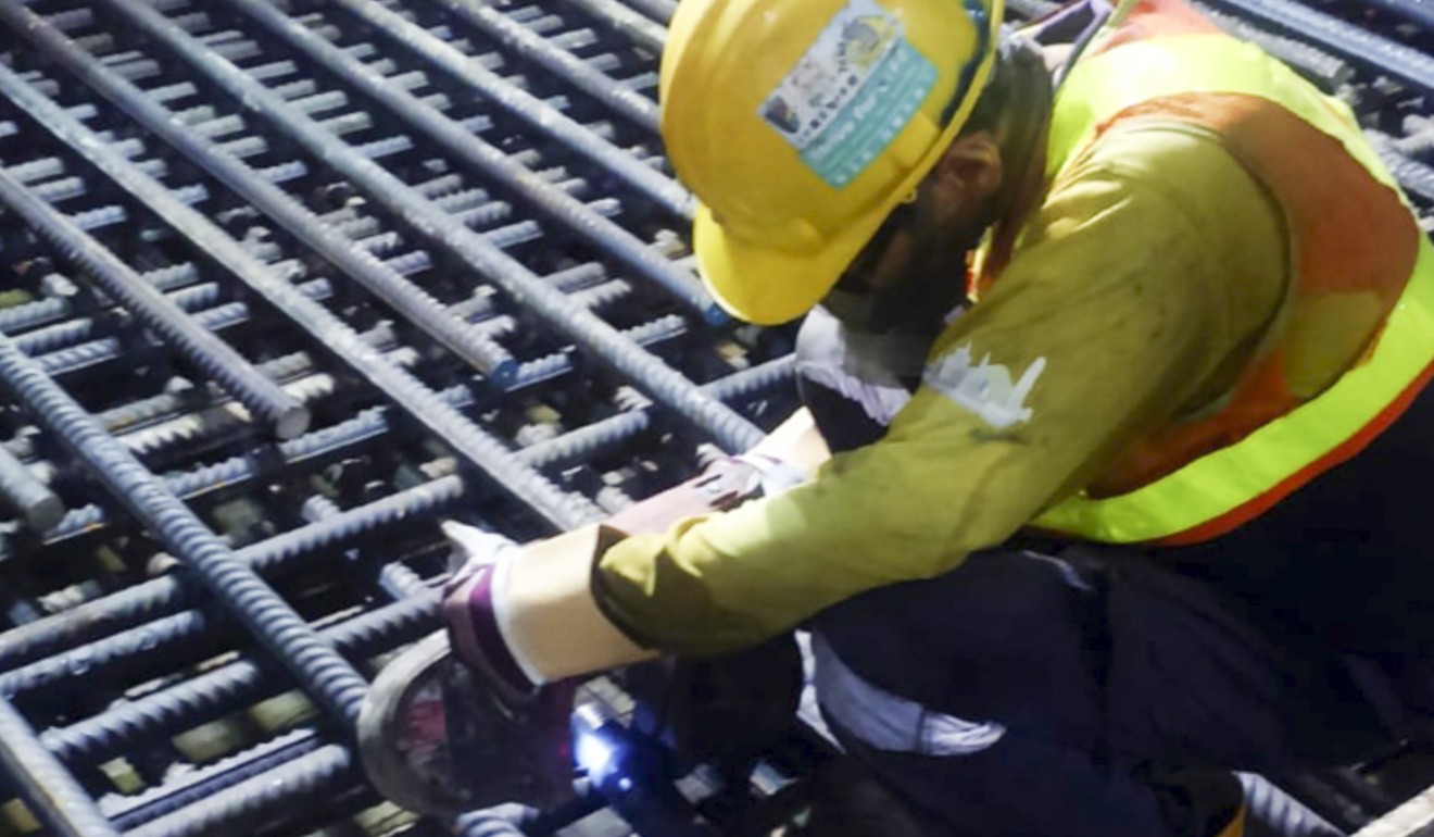 Photographs emerged of workers cutting steel bars short. Photo: SCMP