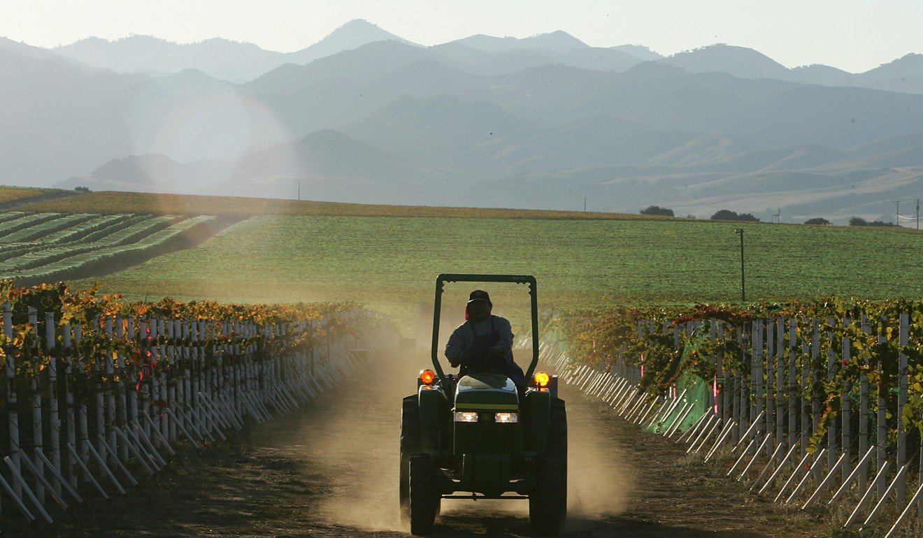 A farm worker drives a tractor through a vineyard in Santa Maria, California. Beijing has realised it should reach out more to ordinary American people. Photo: AFP