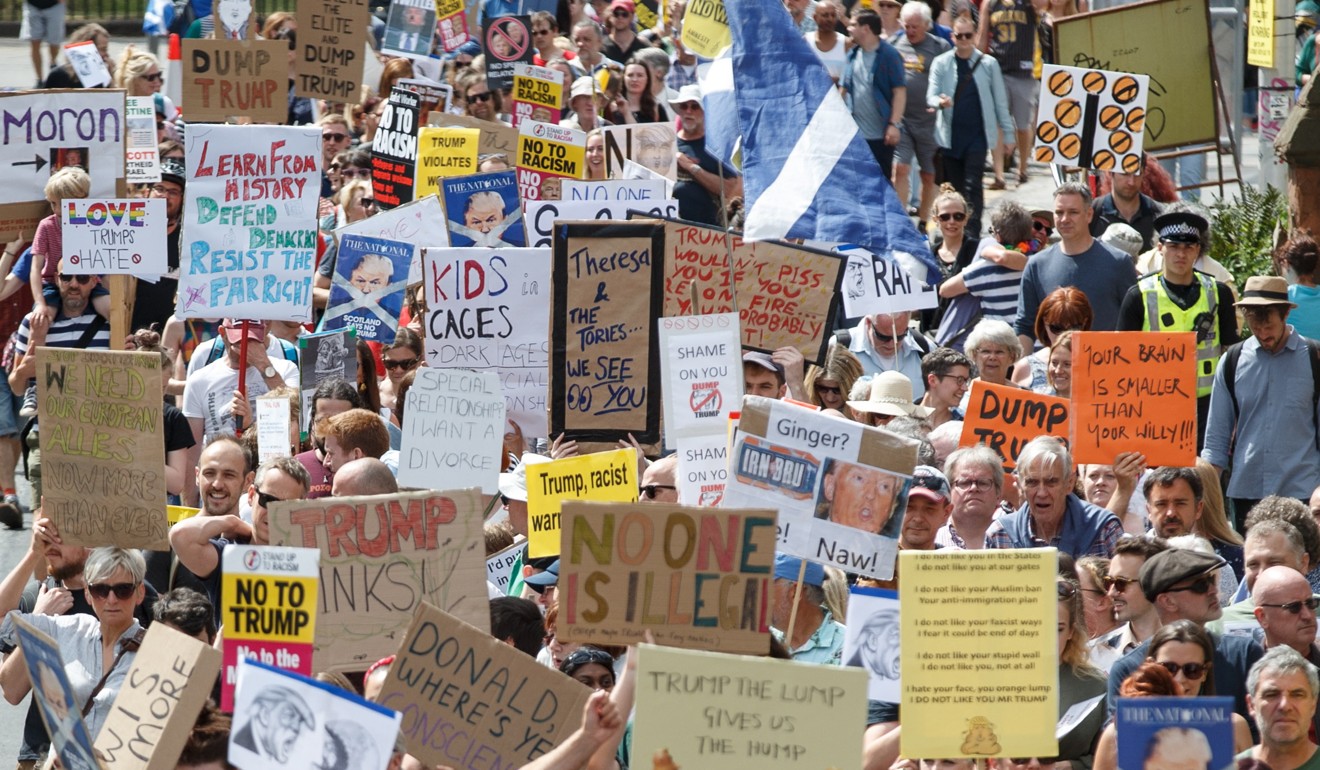People join an anti-Trump protest march in Edinburgh, Scotland, on Saturday. Photo: EPA-EFE