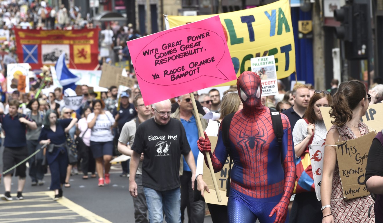 Scotland United Against Trump demonstrators march through the city during a ‘Carnival of Resistance’ towards Trump in Edinburgh on Saturday. Photo: PA via AP
