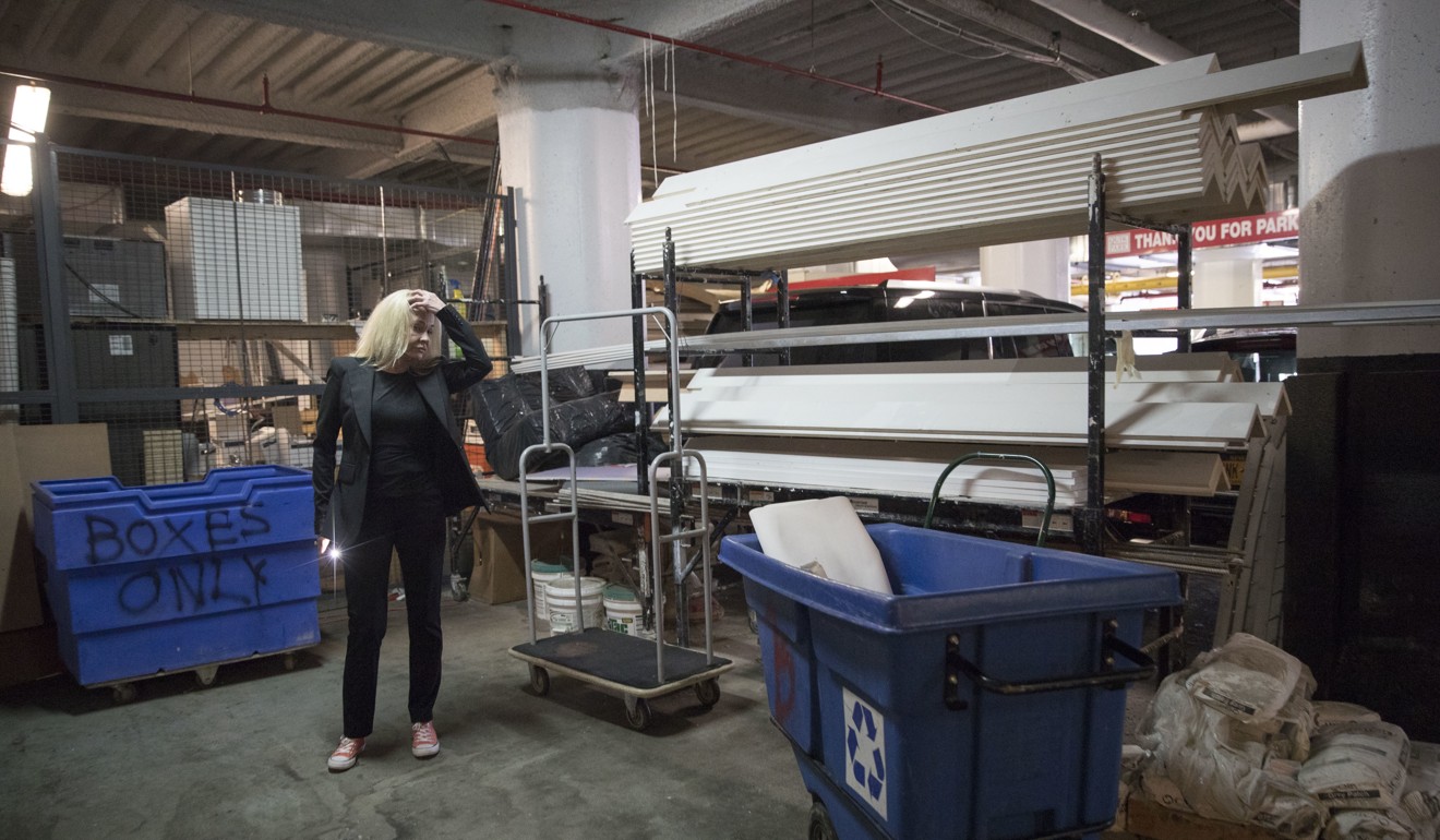 Sabine Anton looks over construction materials stored in the garage of 184 Kent Avenue in the Brooklyn borough of New York in the building owned by Kushner Cos. Photo: AP