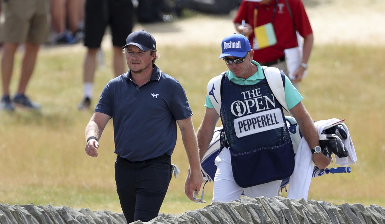 Pepperell and his caddie walks over the bridge onto the 18th. Photo: AP