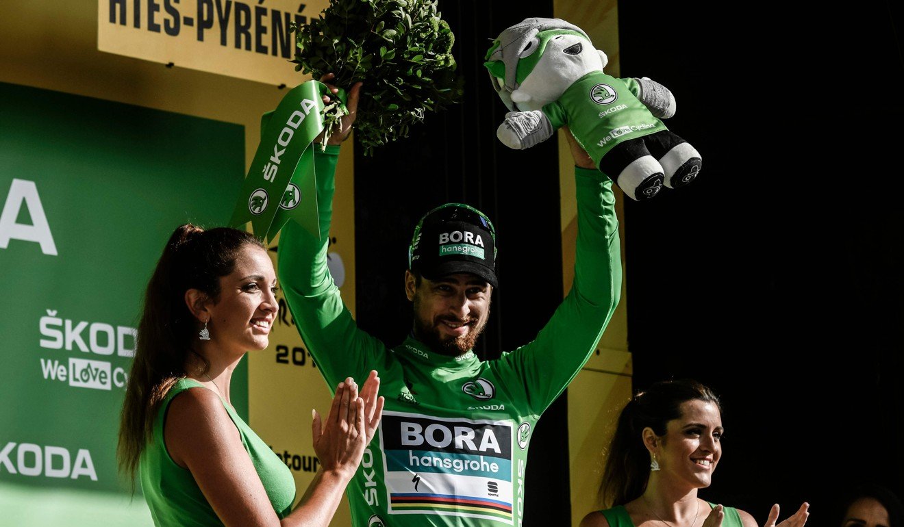 Sagan, wearing the green jersey, celebrates on the podium. Photo: AFP