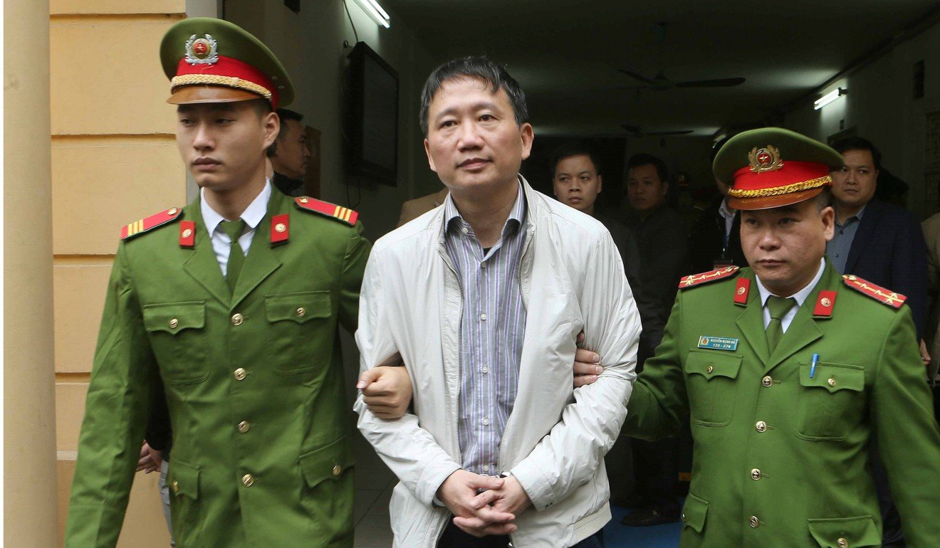 Trinh Xuan Thanh is escorted from a court to prison after his trial in Hanoi, Vietnam, on January 22. Photo: Reuters