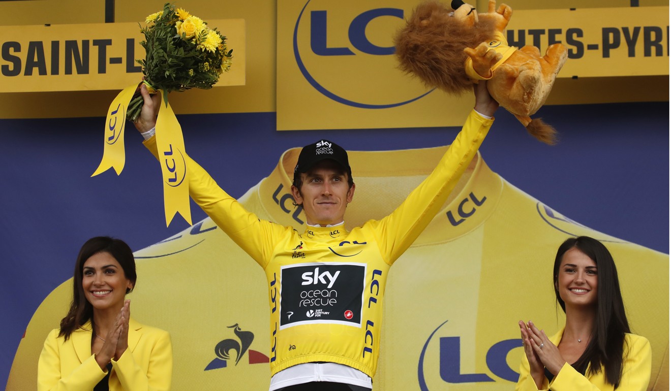 Geraint Thomas, wearing the overall leader’s yellow jersey, celebrates on the podium after the stage 17. Photo: AP