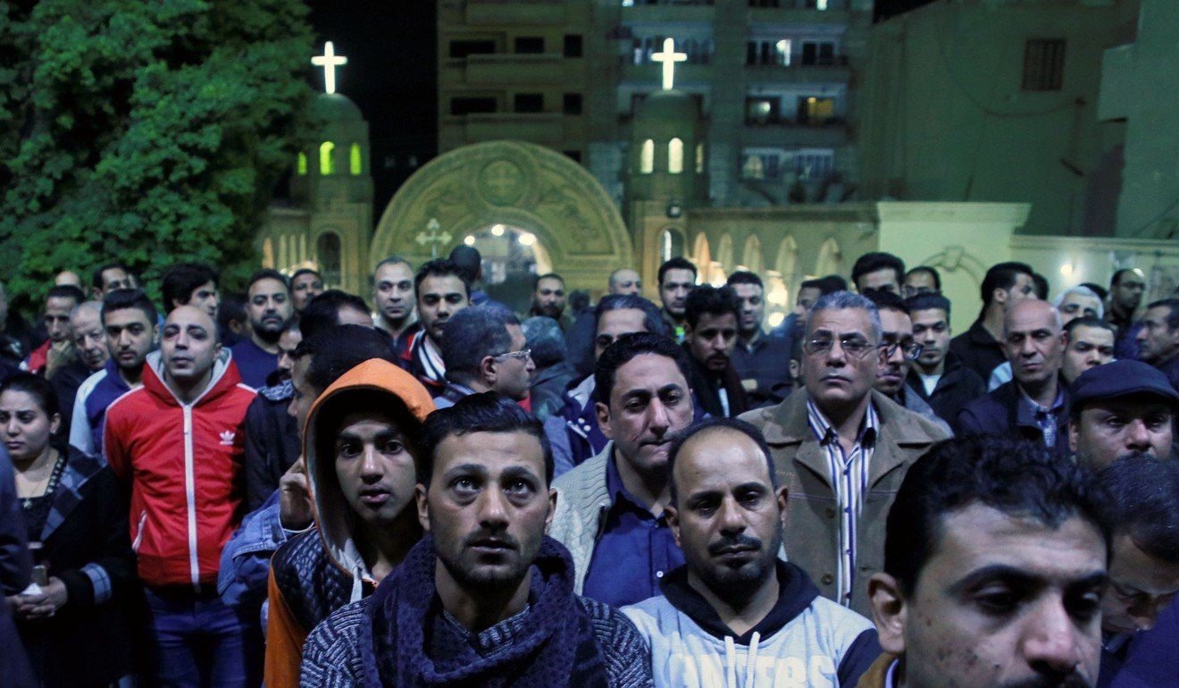 Egyptians attend the funeral of Christians killed in an attack on the Saint Mina Coptic church, south of Cairo. Photo: AFP