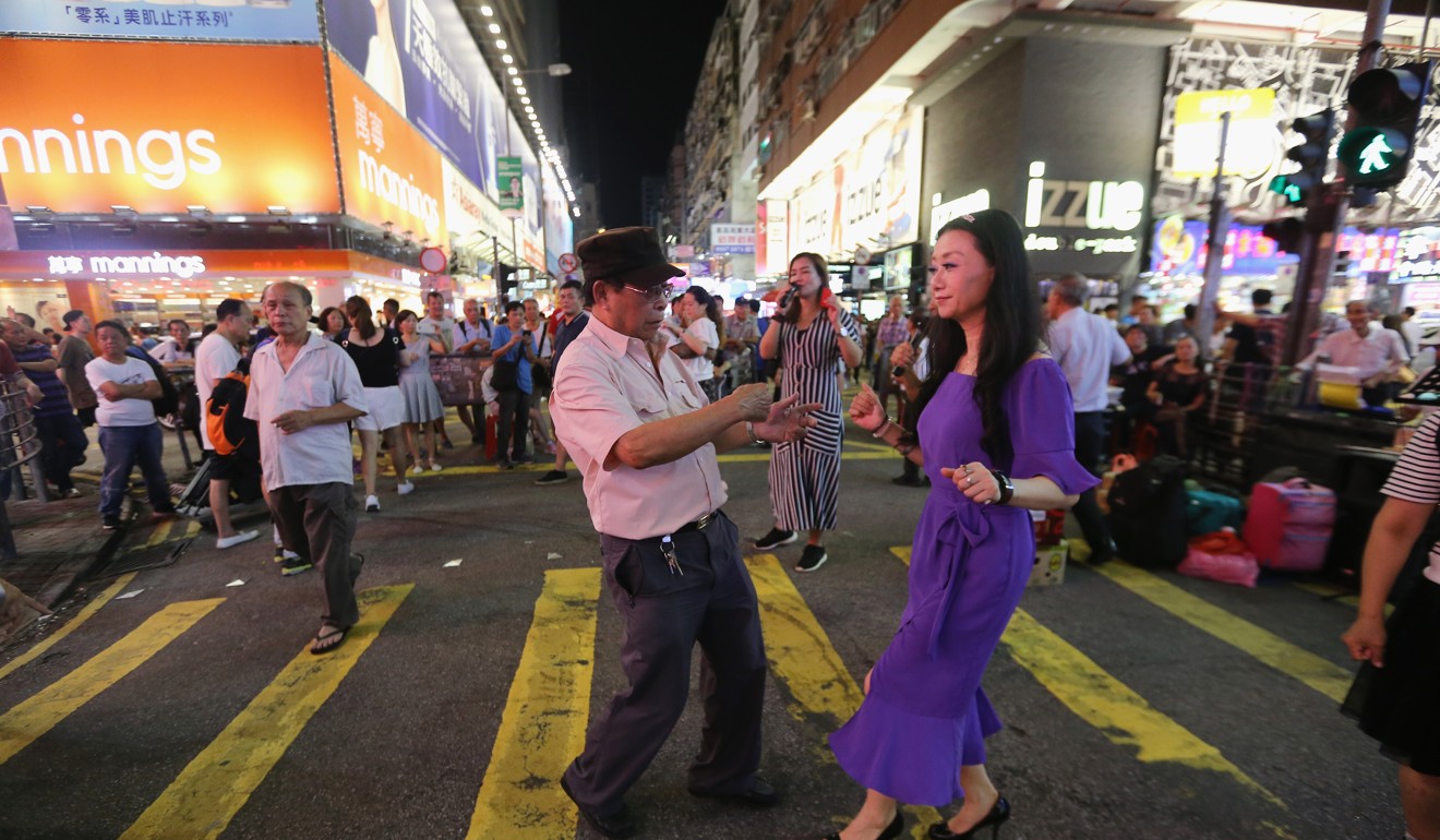 Street performers dancing in the pedestrian zone in Mong Kok for the last time. Photo: Dickson Lee