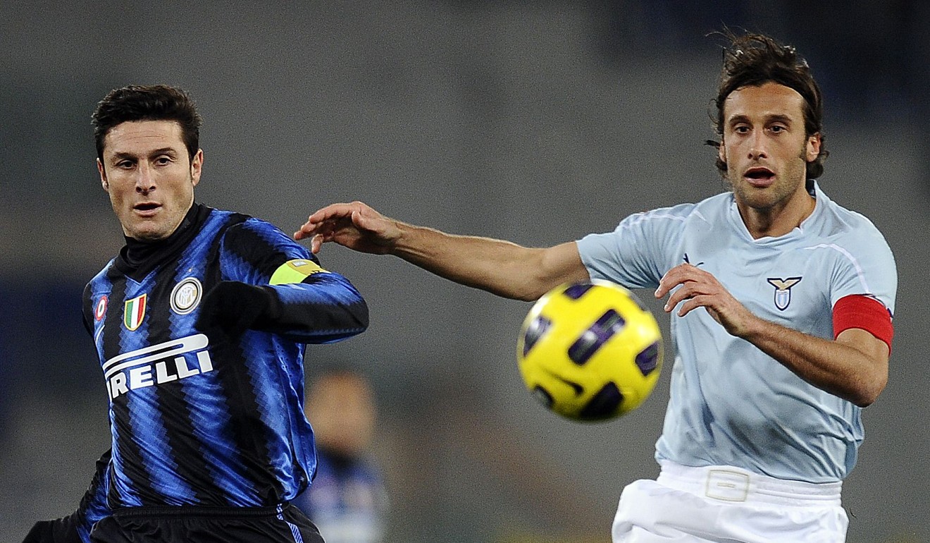 Javier Zanetti vies with Lazio's midfielder Stefano Mauri during their Serie A match in Rome's Olympic Stadium in 2010. Photo: AFP