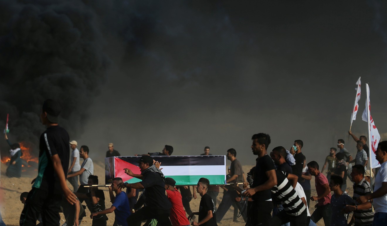 Palestinian demonstrators amid clashes with Israeli troops. Photo: Reuters