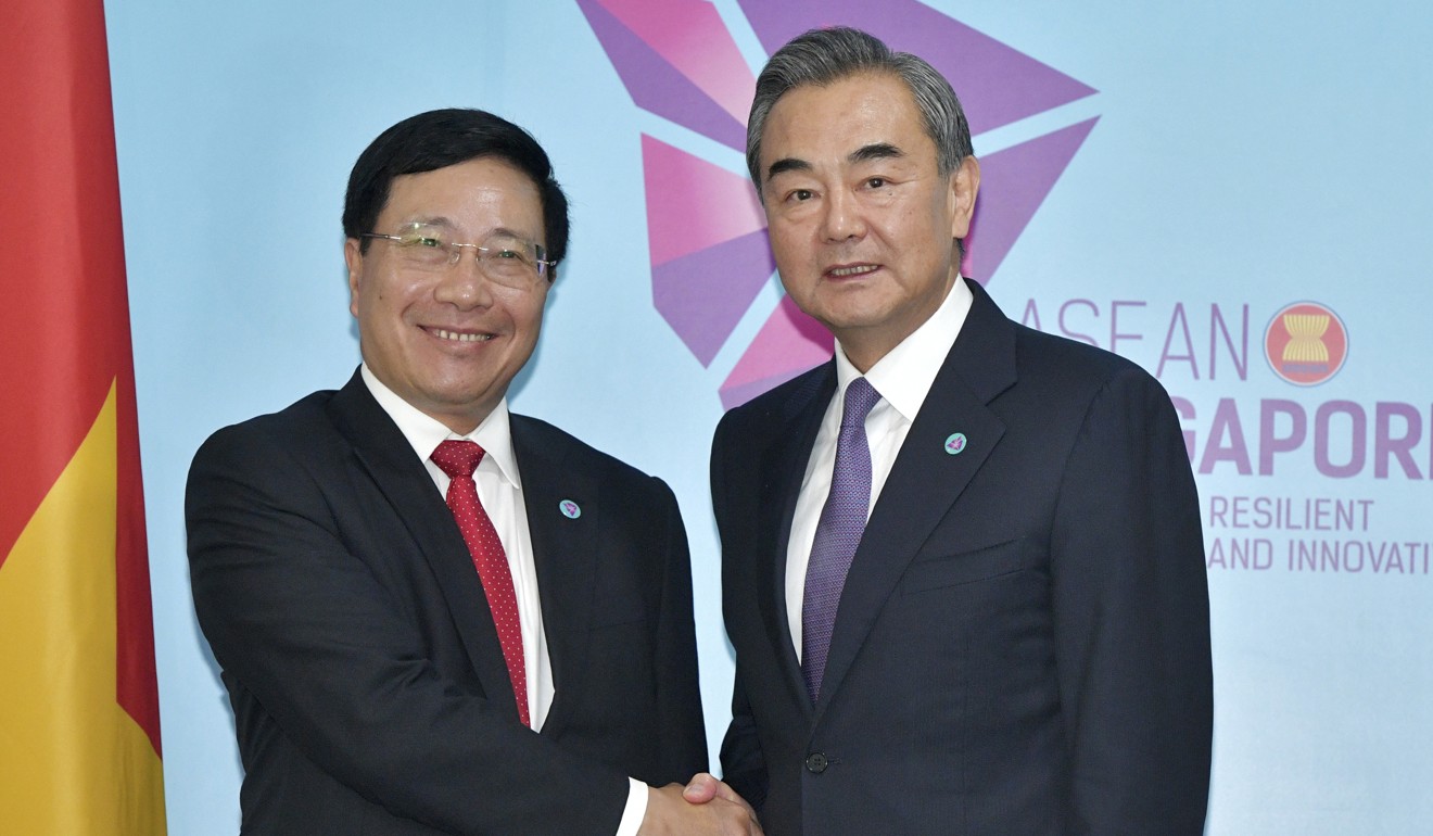 China's Foreign Minister Wang Yi, right, and Vietnam's Foreign Minister Pham Binh Minh. Photo: AP