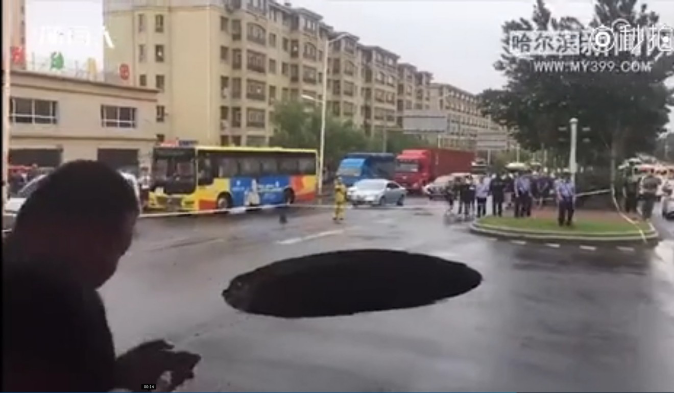 A 8 square metre hole opened up in road in Harbin, Heilongjiang province, on Saturday. Photo: Sina.com