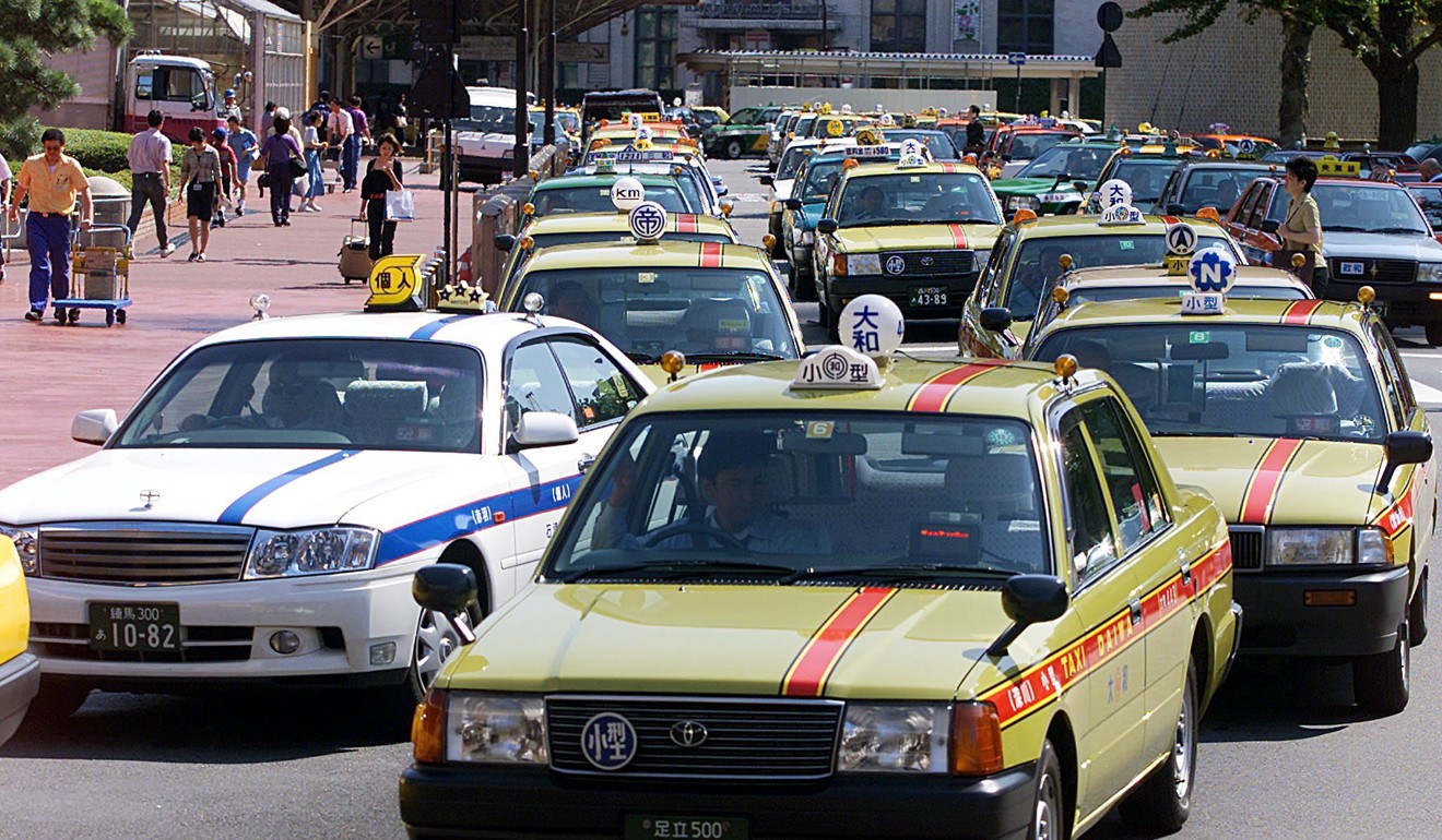File photo of taxis queuing for customers at a Tokyo station. Photo: AFP