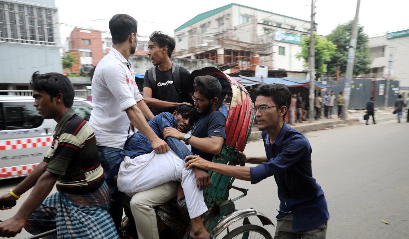 An injured student is taken to hospital. Photo: Reuters