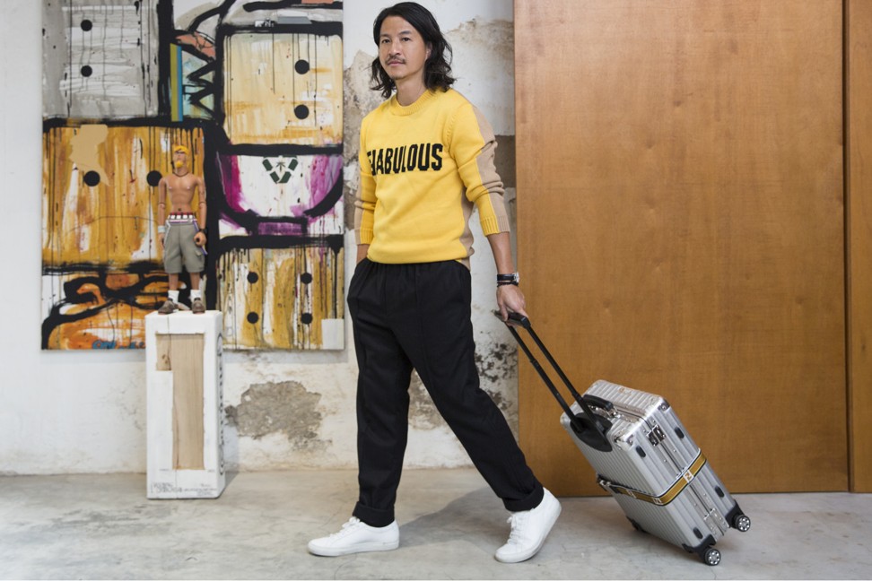 For travel Lau wears a sweater and pants by Fendi, and sneakers by Common Projects. Photo: Michelle Wong