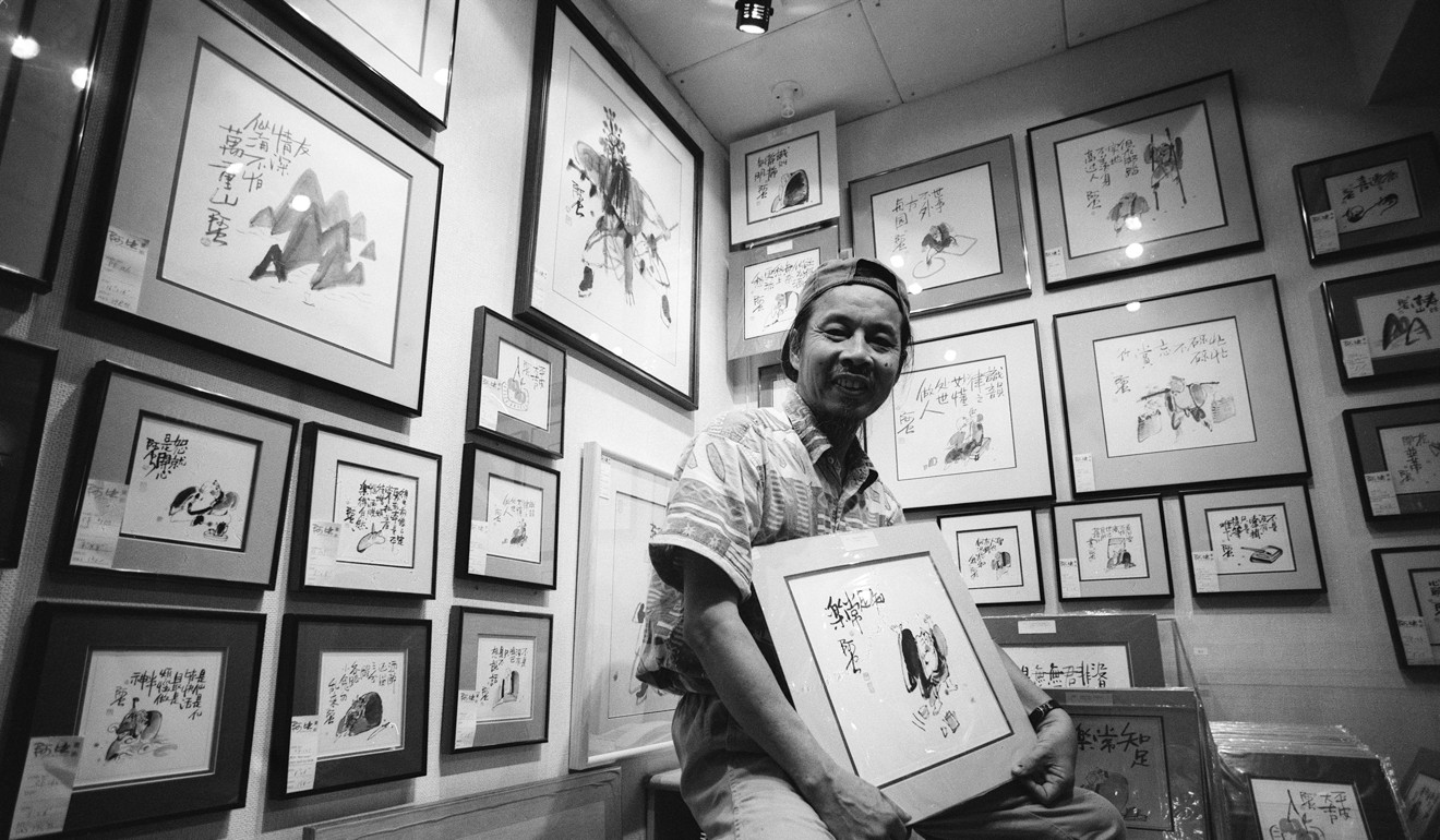 Cartoonist Yim Yee-king with his work. Photo: Paul Lakatos
