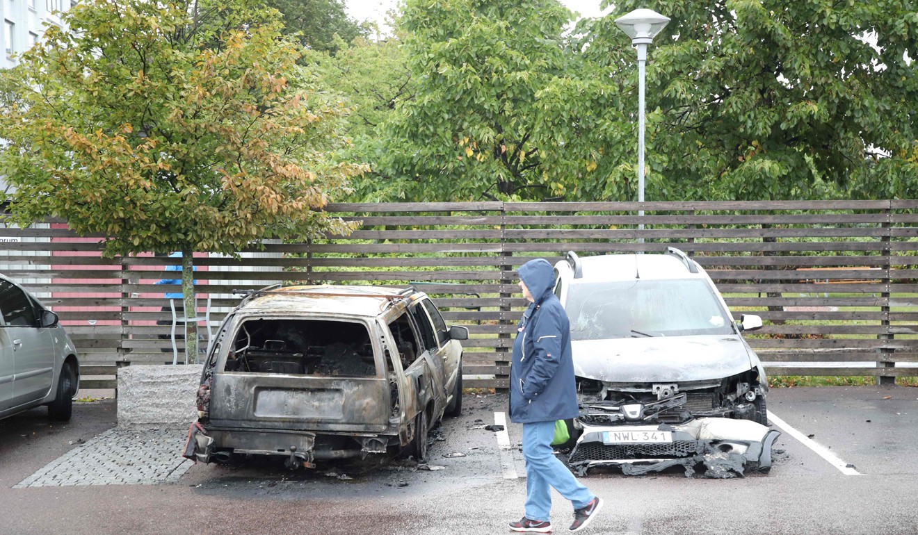 Burned cars at Froelunda Square in Gothenburg. Photo: AFP