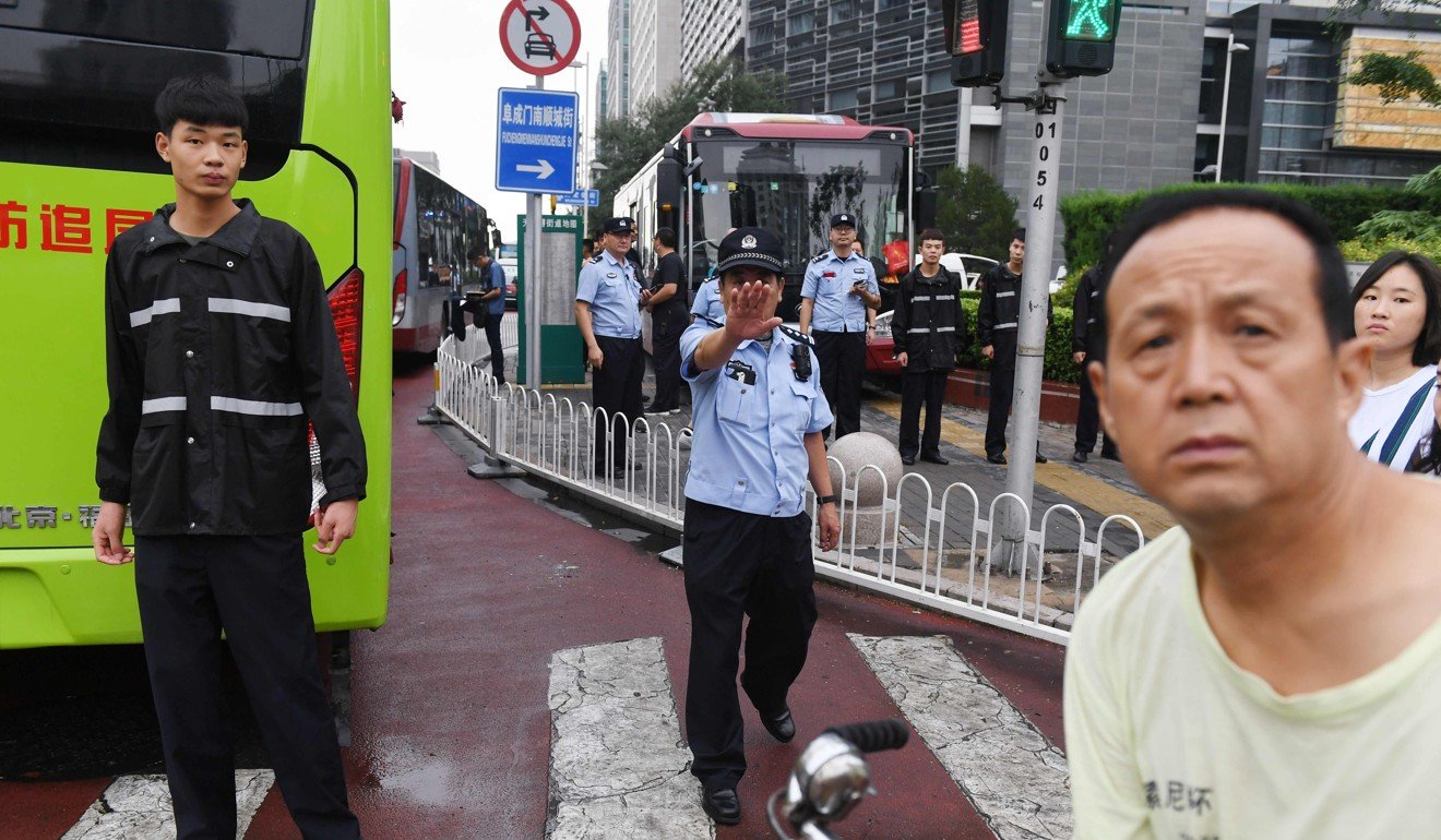 Hundreds of police swarmed the streets of Beijing’s financial district on August 6 as Chinese authorities quashed a planned protest against losses sustained by peer-to-peer lending platforms. Photo: AFP