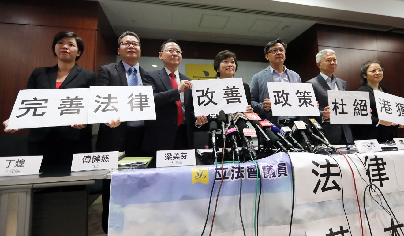 The seven lawyers (seen left to right) Elizabeth Yang, Kacee Ting, Dr Willy Fu, Dr Priscilla Leung, Junius Ho, Stanley Chan, and Montair Xu, make their feelings known on the need to enact national security legislation. Photo: Edward Wong