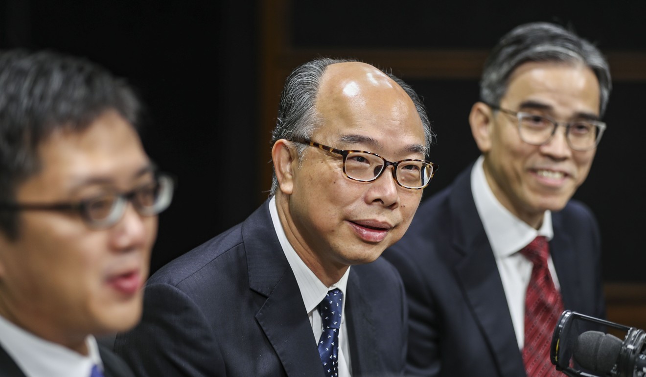 Transport minister Frank Chan (centre), is hoping to make it easier for Hongkongers to buy tickets to travel on the high-speed rail link between the city and the mainland. Photo: Edward Wong