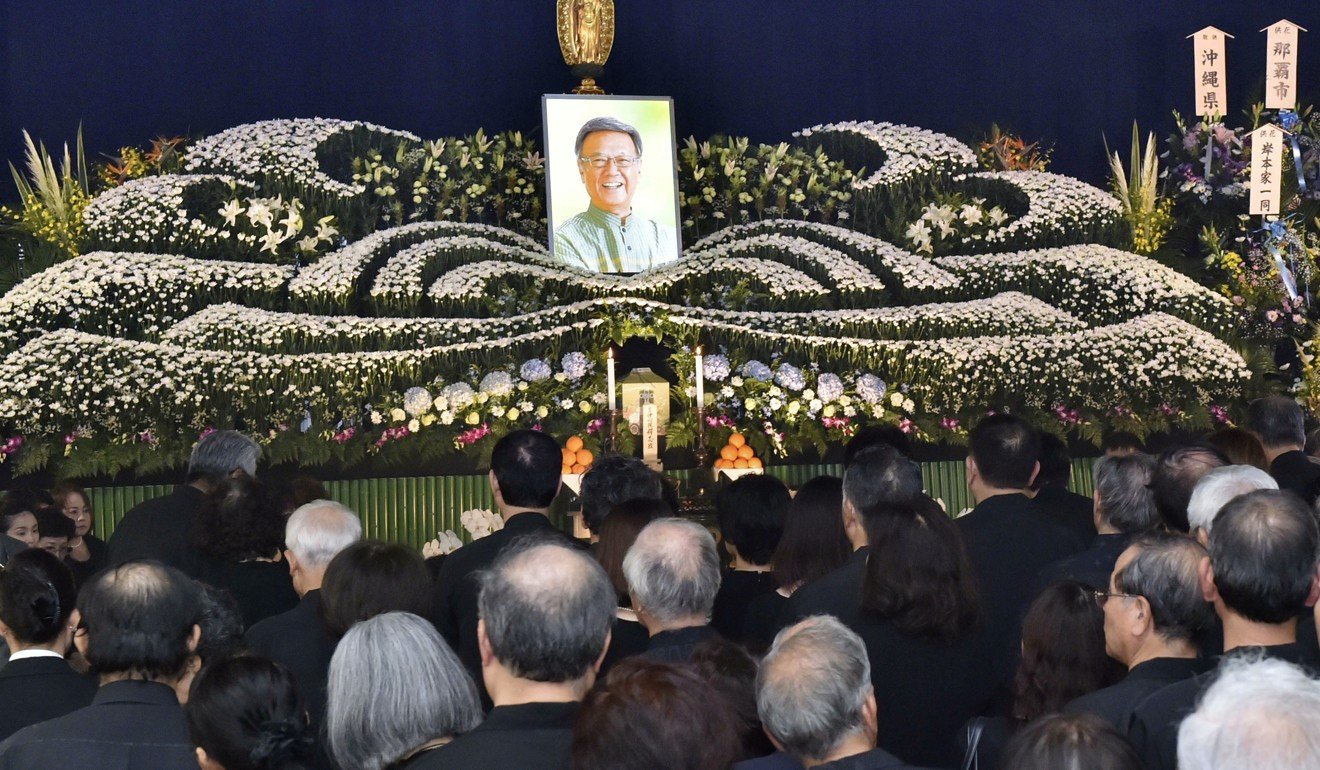 A funeral ceremony for former Okinawa governor Takeshi Onaga, who had fought against the relocation of a US base within the prefecture. Photo: Kyodo