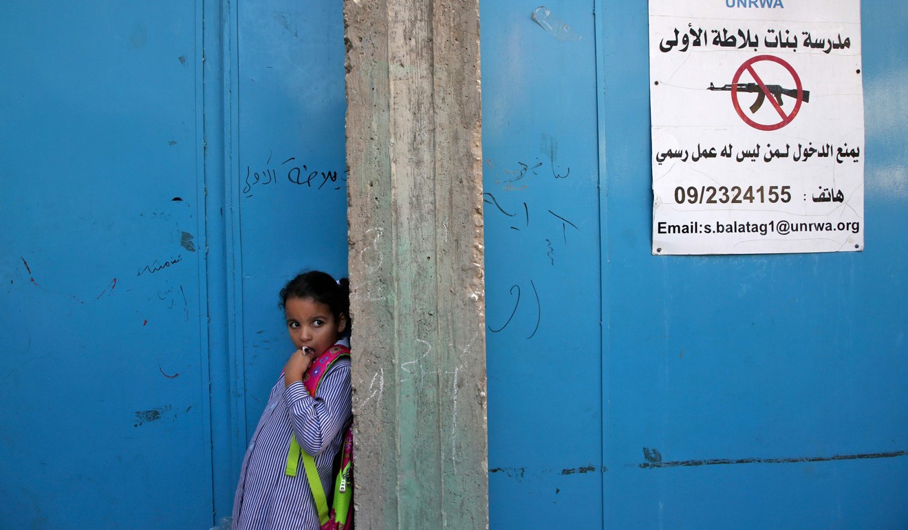A pupil stands at the entrance of a school in the Balata refugee camp, in the West Bank on Wednesday. Photo: AFP