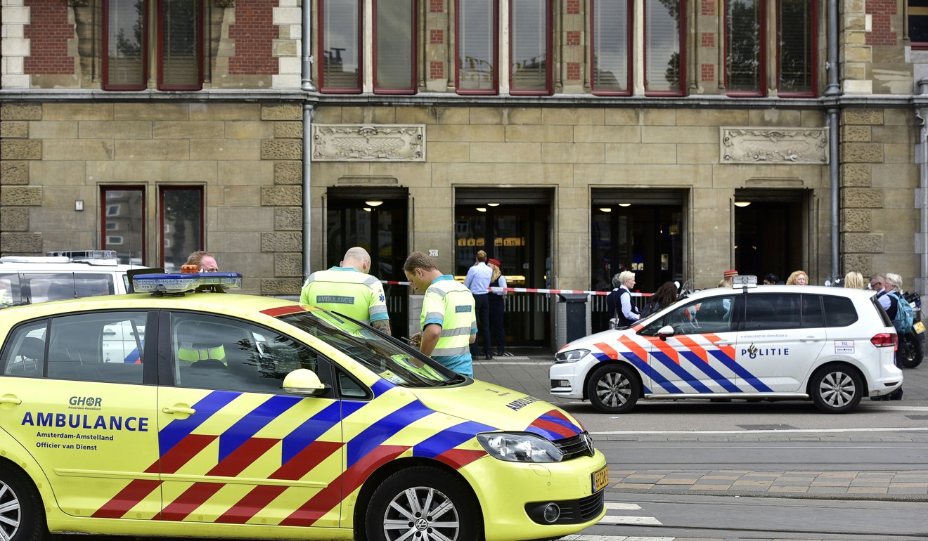 The police after the stabbing on Friday at Amsterdam’s Central Station.