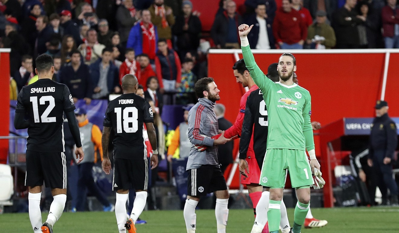 Manchester United goalkeeper David de Gea gestures to the away supporters at the end of the Champions League trip to Sevilla. Photo: AP