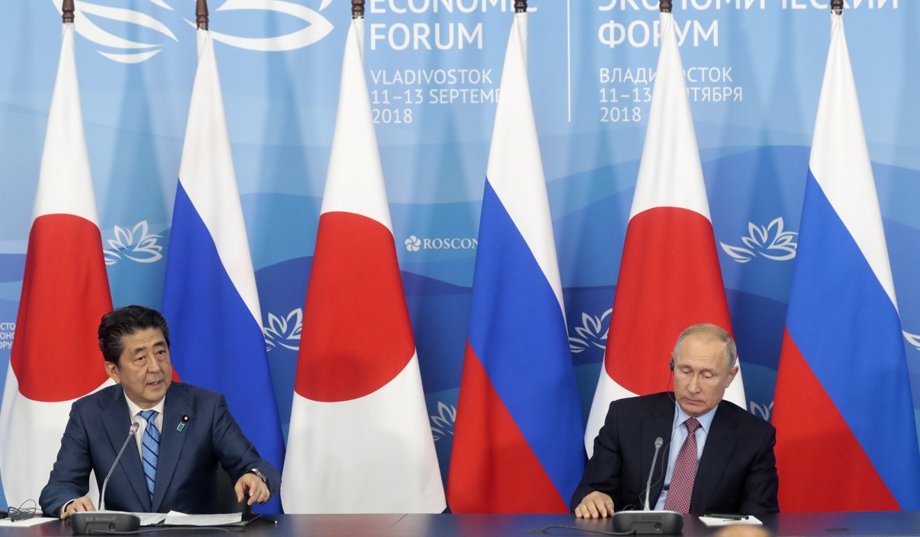 Abe and Putin deliver their statements at a joint press conference following their talks in Vladivostok, Russia on Monday. Photo: EPA-EFE