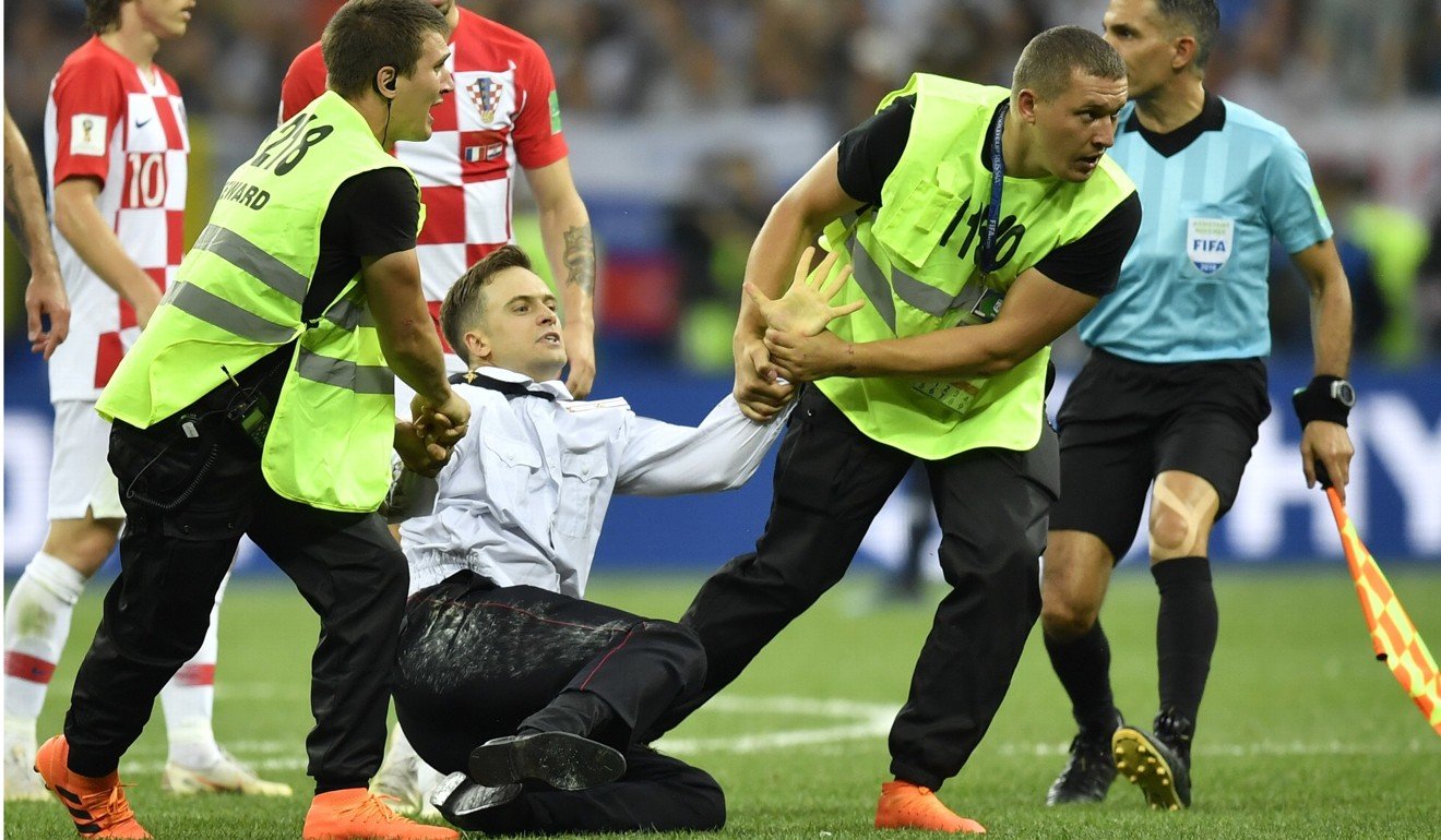 Verzilov being taken off the pitch during the final match between France and Croatia at the 2018 World Cup in the Luzhniki Stadium in Moscow. Photo: AP