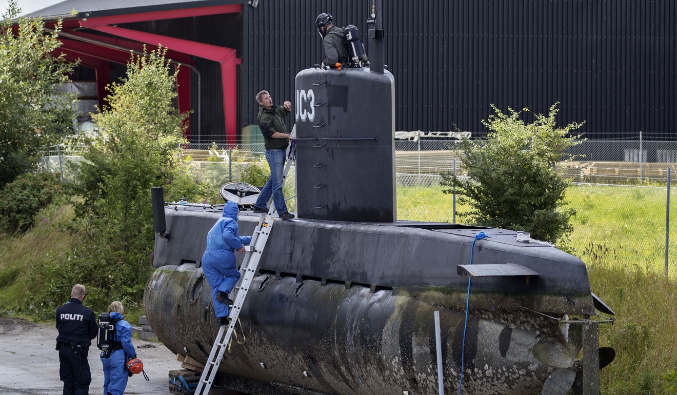 File photo of police inspecting Madsen’s submarine. Photo: AP