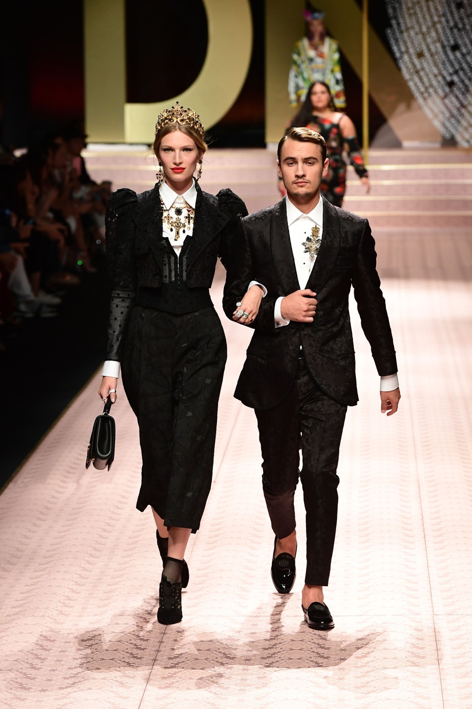 Models Liz Kennedy and Brandon Lee were among those who strode the catwalk. Photo: AFP