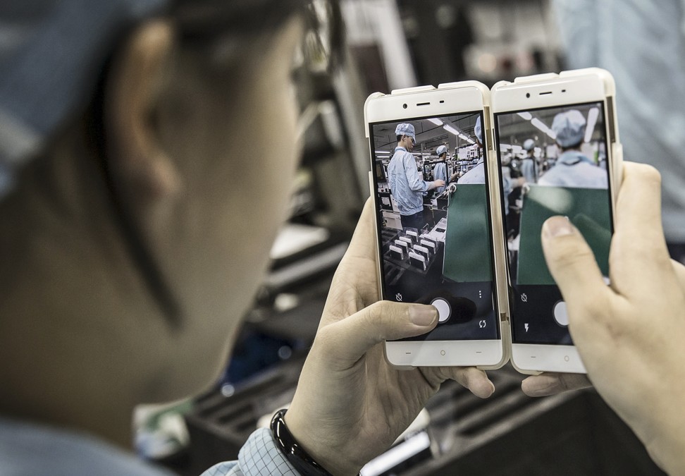 OnePlus X smartphones at the OnePlus manufacturing facility in Dongguan, China. Chinese mobile phone companies are making inroads into the market shares of global leaders, including Apple. Photo: Bloomberg
