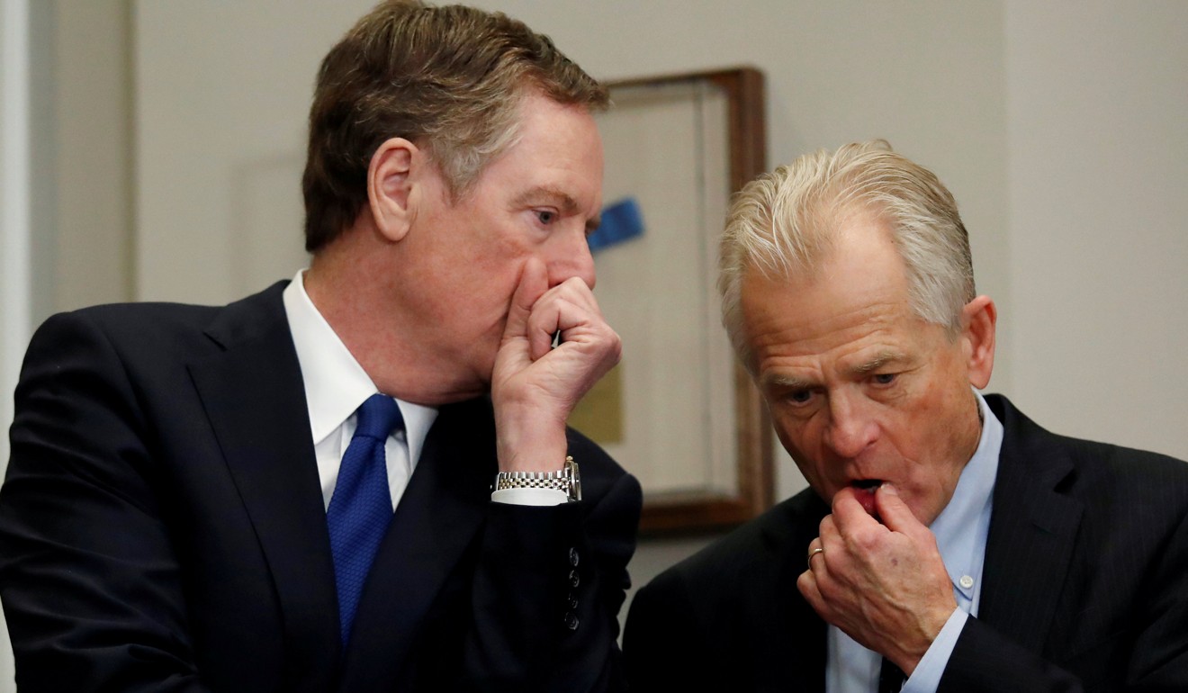 US Trade Representative Robert Lighthizer (left) and Peter Navarro, President Donald Trump’s adviser on trade and industrial policy, chat while waiting for Trump to make an announcement about tariffs on steel and aluminium imports at the White House on March 8. Lighthizer and Navarro are among the trade hawks in Trump’s government who favour increased restrictions and pressure to counter China’s “unfair” trade practices and growing power in the Asia-Pacific. Photo: Reuters