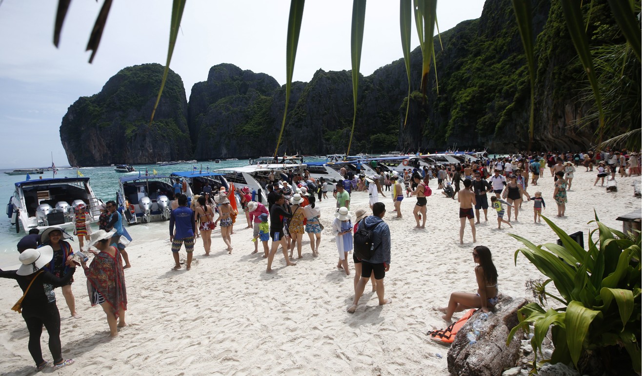 Tourists enjoying the beach on Maya Bay before it closed. Photo: AP