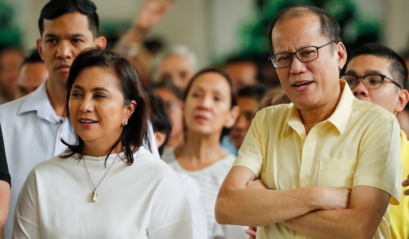 Vice-President Leni Robredo, alongside former president Benigno Aquino, is the constitutional successor to Duterte but has been undermined by him. Photo: EPA