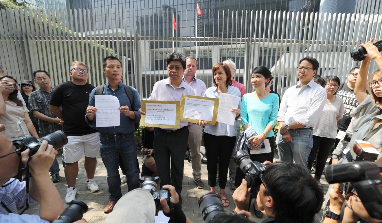Several journalist groups hold a rally outside Hong Kong government headquarters in Admiralty on Monday to call for a full explanation for the refusal to renew a work visa for Financial Times journalist Victor Mallet. Photo: Edward Wong/SCMP