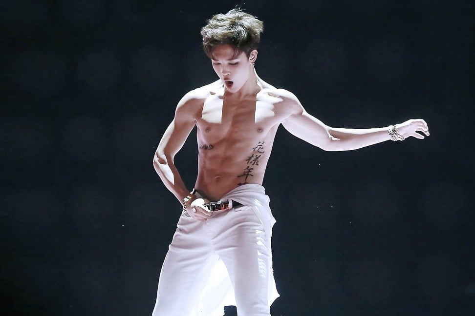 Jimin shows his abs while performing on stage with the K-pop band BTS. Photo: jamjam.kr