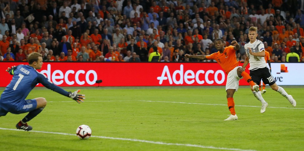 Netherland’s Georginio Wijnaldum scores his side’s third goal against Germany. Photo: AP