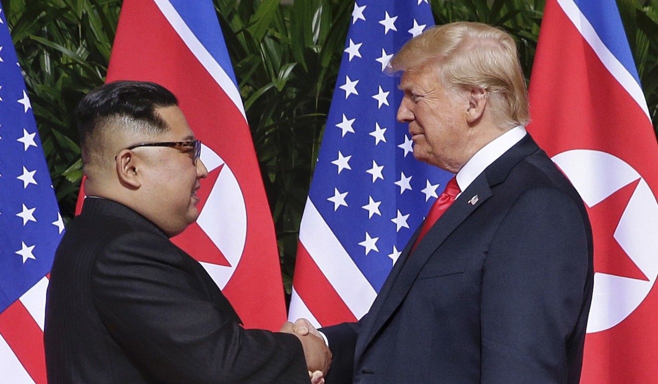 US President Donald Trump and North Korean leader Kim Jong-un meet for their historic June summit in Singapore. Photo: EPA