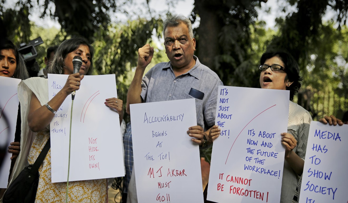 An Indian journalist holds a placard demanding the removal of Junior Foreign Minister M.J. Akbar. Photo: AP.