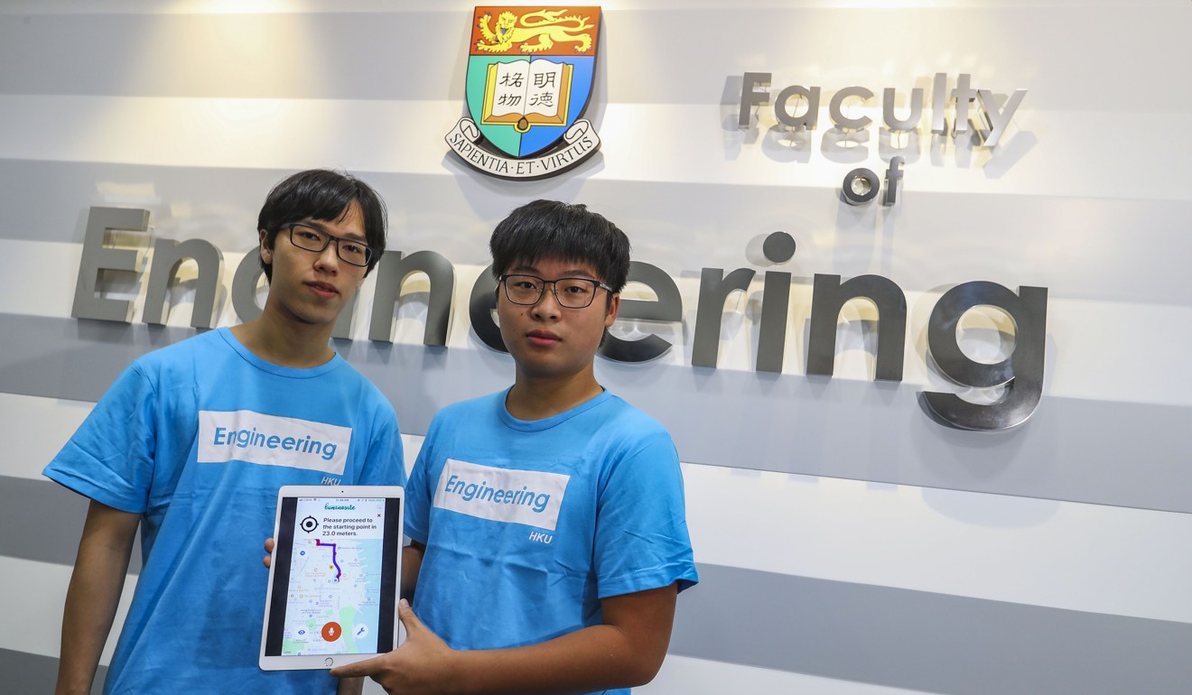 Luminosite team members Yueng Tsz-lok (left), and Felix Wong display their app during a press conference at the University of Hong Kong. Photo: Edmond So