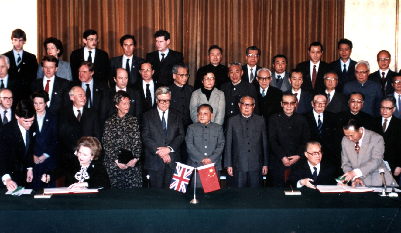 Late paramount leader Deng Xiaoping (front, centre) flanked by Chinese and UK officials in Beijing attending the signing ceremony of the Sino-British Joint Declaration setting forth the terms of Hong Kong’s handover in 1997. Photo: Xinhua