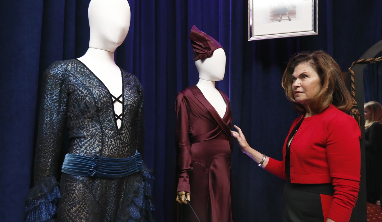 Oscar-winning costume designer Colleen Atwood stands beside two of her designs created for the film, ‘Fantastic Beasts: The Crimes of Grindelwald’ at Neiman Marcus ‘The Christmas Book 2018’ fantasy gifts preview in New York. Photo: AP
