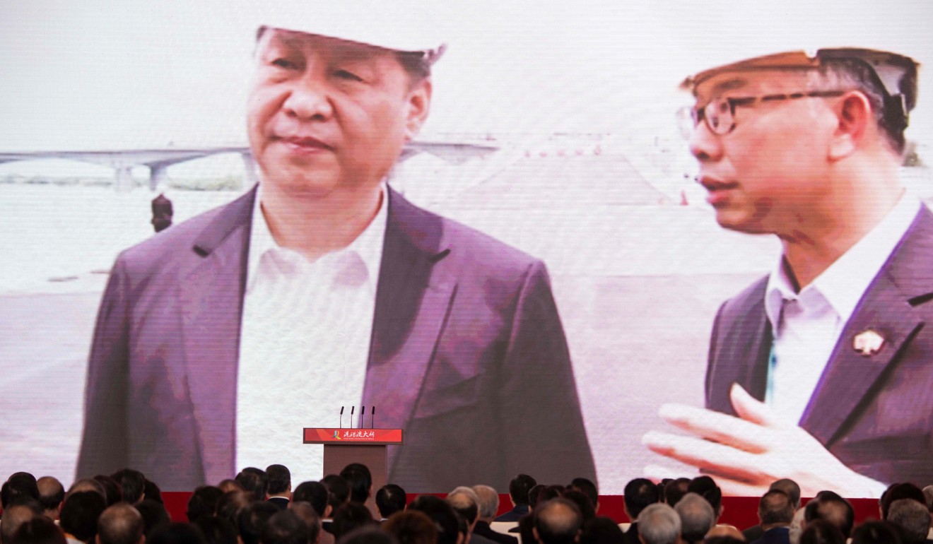 President Xi Jinping shown with Hong Kong’s transport secretary Frank Chan Fan during the opening of the Hong Kong-Zhuhai-Macau Bridge. Photo: AFP