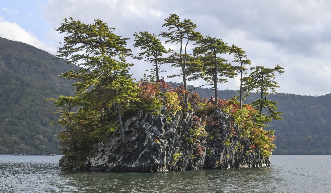 A boat trip is the only way to see the leaves turning on some of the islets in Lake Towada. Photo: Pete Ford