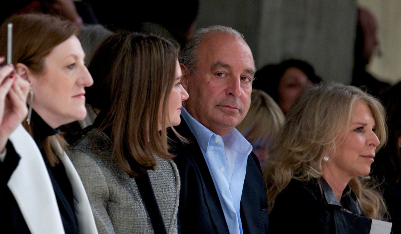British businessman and owner of Topshop Philip Green second right) attends a show at London Fashion Week in this 2013 file photo. Photo: Agence France-Presse