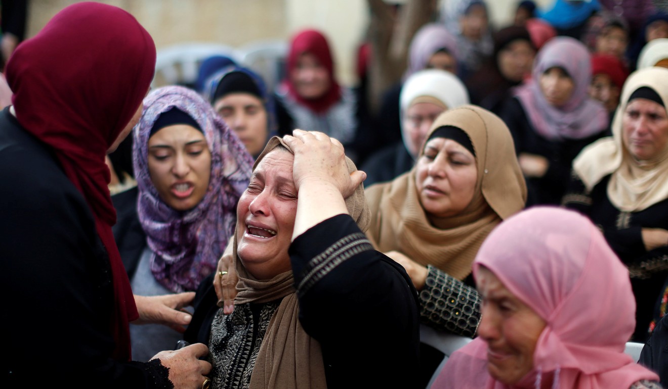 Relatives of Palestinian protester Othman Ladadwah, who was killed by Israeli soldiers, during his funeral in the village of Al-Mazraa Al-Gharbeya in the occupied West Bank on October 27, 2018. Photo: Reuters