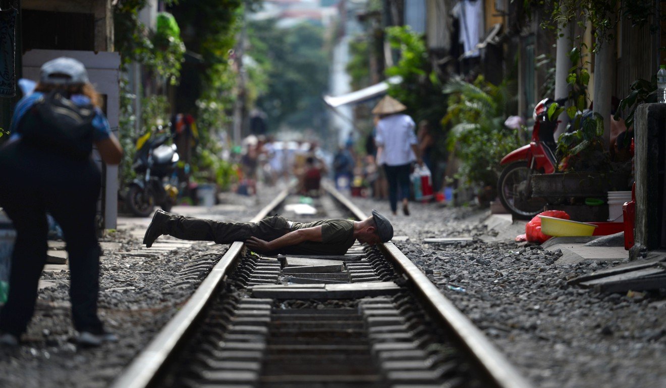 Someone “planks” on the railway tracks. Photo: AFP