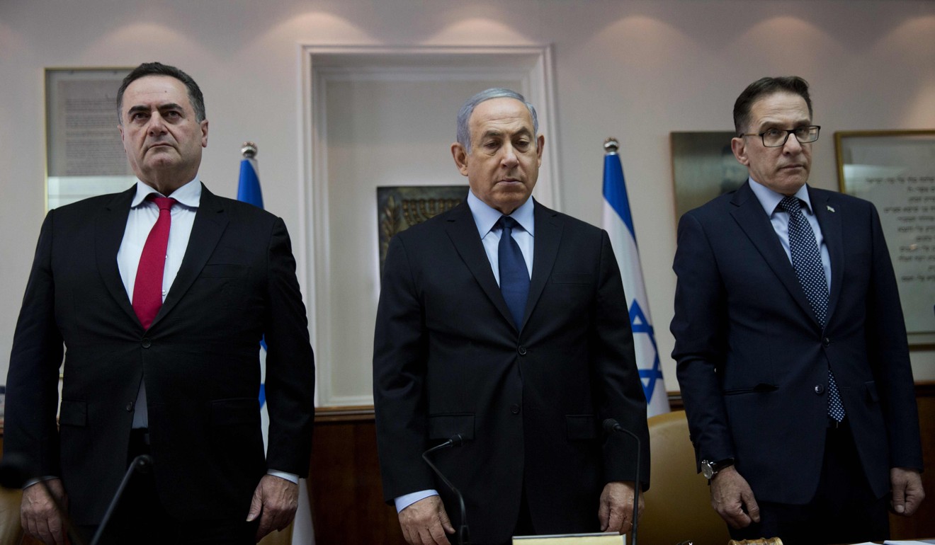 Israeli Prime Minister Benjamin Netanyahu (centre), Minister of Transport Yisrael Katz (left) and Cabinet Secretary Tzachi Braverman, stand for a moment of silence for the victims of the Pittsburgh synagogue shooting attack. Photo: AFP