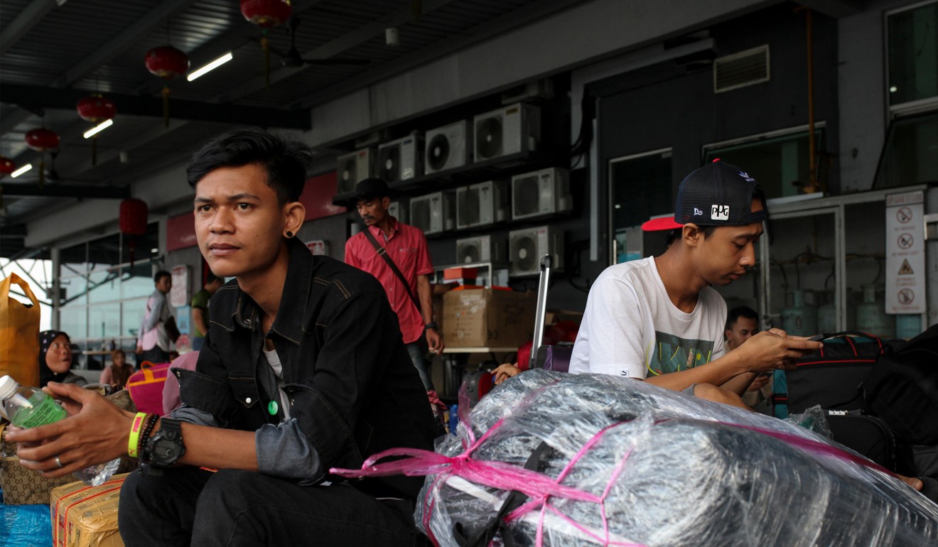 Indonesian migrant workers in Malaysia wait for a ferry home to celebrate the Muslim holiday of Eid ul-Fitr with their families in June this year. Photo: Alamy